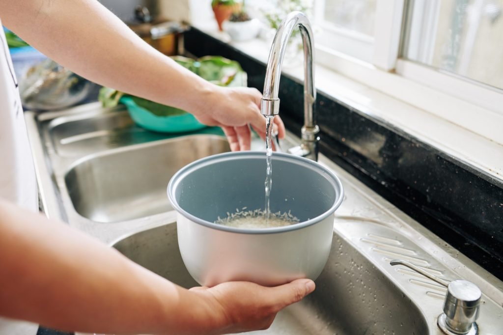 Person rinsing rice