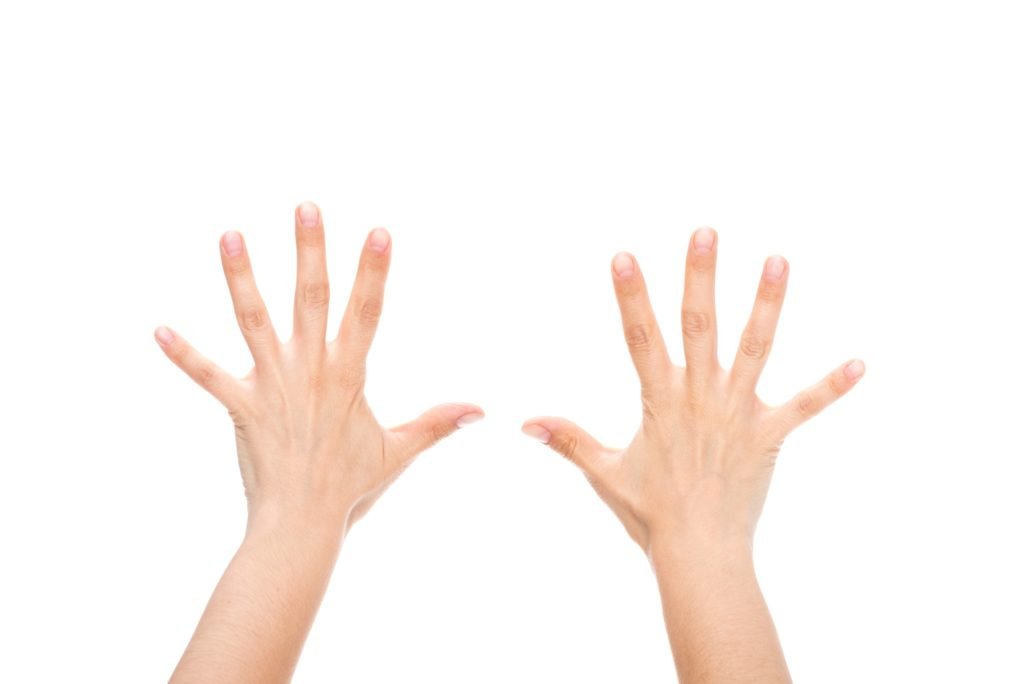 partial view of female hands showing ten fingers isolated on white