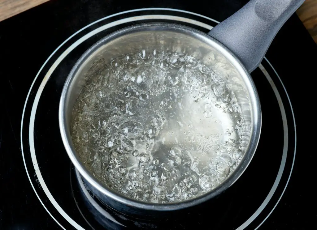 kettle of boiling water on electric induction hob