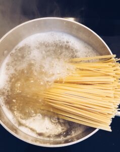 Spaghetti pasta cooking in a pot