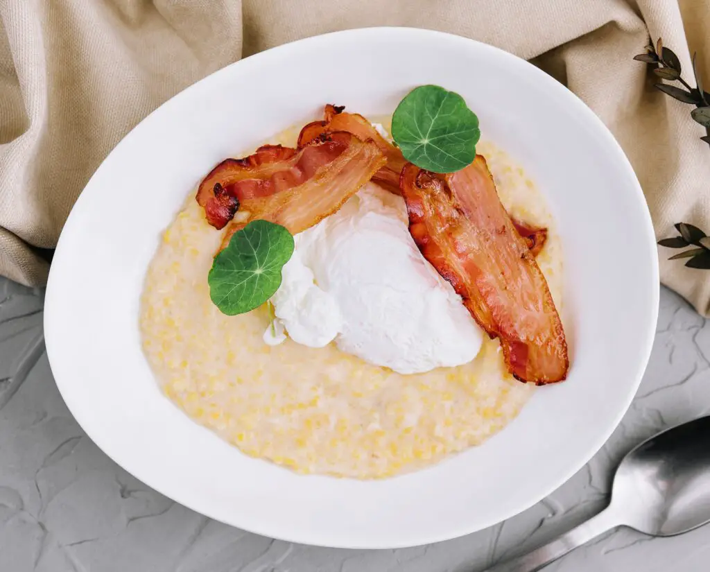 Savory oatmeal porridge with poached egg and bacon