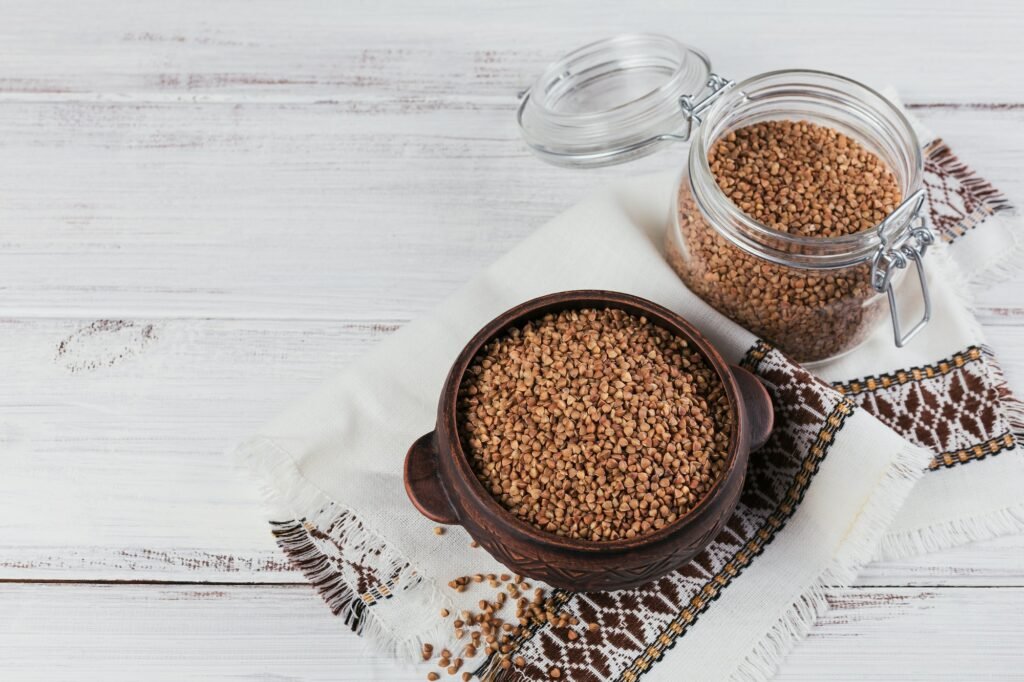 Buckwheat groats close up. Grains of raw buckwheat as a background texture.