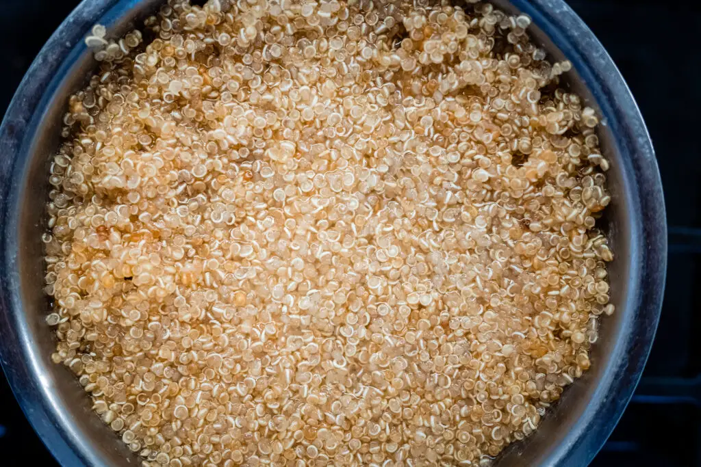 Detail of a bowl with quinoa boiled in hot water, a protein superfood.